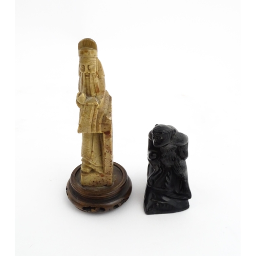 1028 - Two Chinese soapstone carvings, one modelled as a monkey, the other as a stylised sage / scholar fig... 