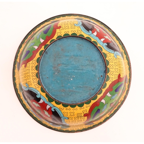 1029 - A Chinese cloisonne bowl of flared form, the yellow ground with stylised mask detail, the interior w... 