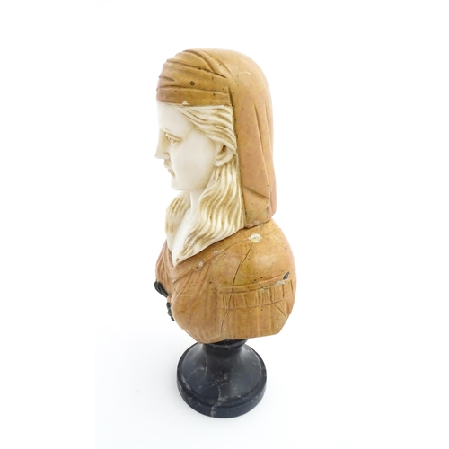 1063 - A 20thC marble bust depicting a female woman wearing a headdress, on a turned socle. Approx. 12