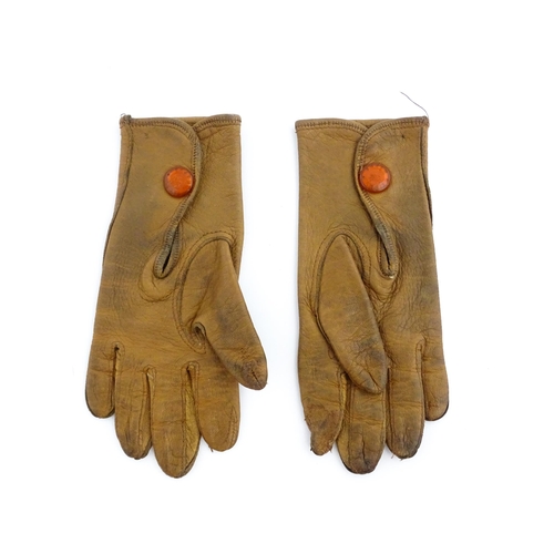 1080 - A pair of early 20thC childrens kid leather gloves. Together with a beadwork bag (2). Gloves approx.... 