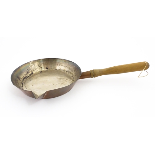 1110 - A 19thC Elkington & Co silver plate pan with spout and a wooden handle. Approx. 19 1/2