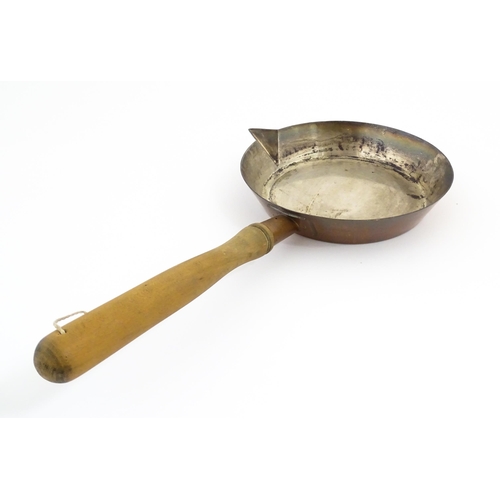 1110 - A 19thC Elkington & Co silver plate pan with spout and a wooden handle. Approx. 19 1/2