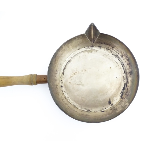 1110 - A 19thC Elkington & Co silver plate pan with spout and a wooden handle. Approx. 19 1/2