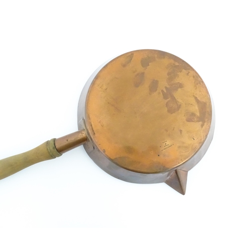 1110 - A 19thC Elkington & Co silver plate pan with spout and a wooden handle. Approx. 19 1/2