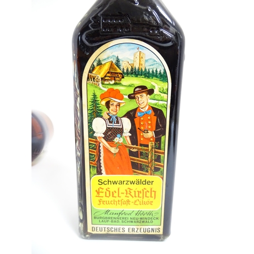 1124 - A 70cl bottle of Benedictine liqueur, together with a 70cl bottle of Schwarzwälder Edel-Kirsch lique... 