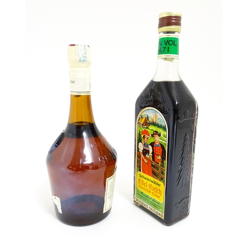 1124 - A 70cl bottle of Benedictine liqueur, together with a 70cl bottle of Schwarzwälder Edel-Kirsch lique... 