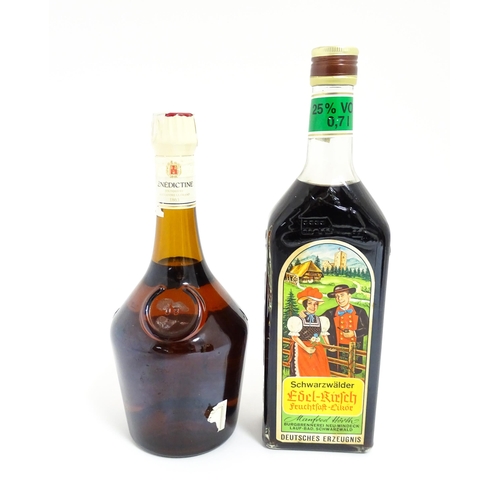 1124 - A 70cl bottle of Benedictine liqueur, together with a 70cl bottle of Schwarzwälder Edel-Kirsch lique... 