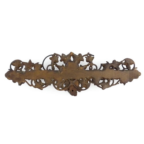 1196 - An early 20thC Black Forest pipe rack with provision for eight pipes, with carved castle and drawbri... 