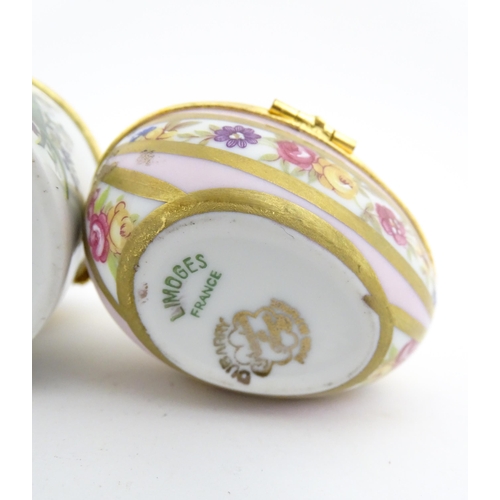 1210 - Two 20thC Limoges Dubarry porcelain boxes, one modelled as an egg with floral detail, the other of c... 