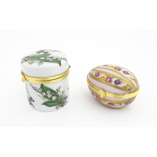 1210 - Two 20thC Limoges Dubarry porcelain boxes, one modelled as an egg with floral detail, the other of c... 