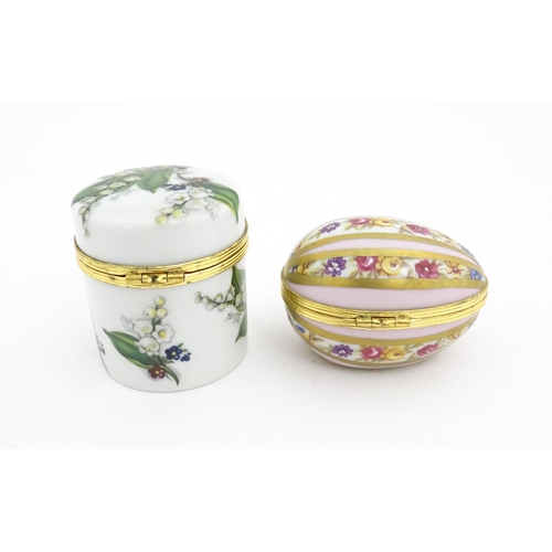 1210 - Two 20thC Limoges Dubarry porcelain boxes, one modelled as an egg with floral detail, the other of c... 