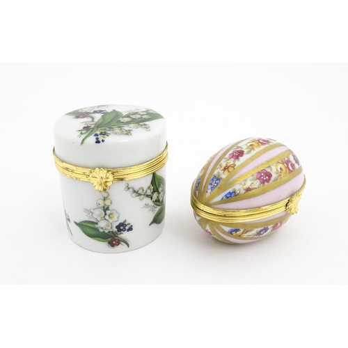 1210 - Two 20thC Limoges Dubarry porcelain boxes, one modelled as an egg with floral detail, the other of c... 