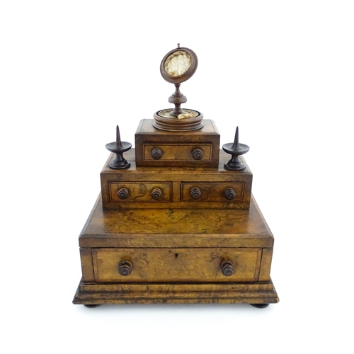 1244 - A 19thC burr walnut tiered sewing box / casket, of stepped form, comprising three sections containin... 