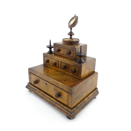 1244 - A 19thC burr walnut tiered sewing box / casket, of stepped form, comprising three sections containin... 