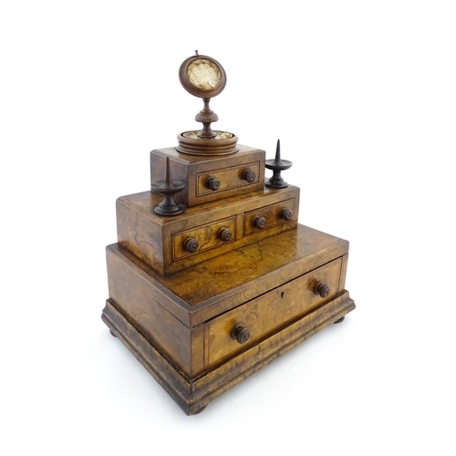 1244 - A 19thC burr walnut tiered sewing box / casket, of stepped form, comprising three sections containin... 