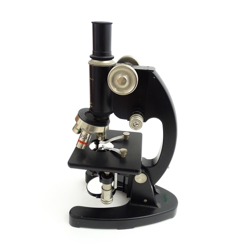 1247 - A mid 20thC laboratory microscope by Cooke, Troughton & Simms Ltd, York, fitted with rotary lenses o... 