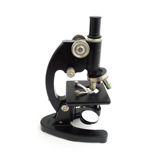 1247 - A mid 20thC laboratory microscope by Cooke, Troughton & Simms Ltd, York, fitted with rotary lenses o... 