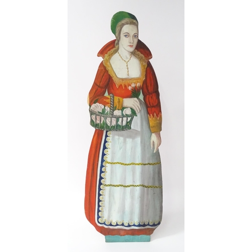 1267 - A large 20thC figural dummy board with hand painted decoration depicting a young lady holding a bask... 