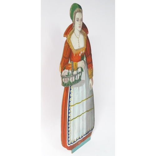 1267 - A large 20thC figural dummy board with hand painted decoration depicting a young lady holding a bask... 