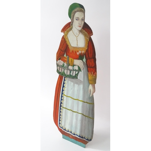 1267 - A large 20thC figural dummy board with hand painted decoration depicting a young lady holding a bask... 