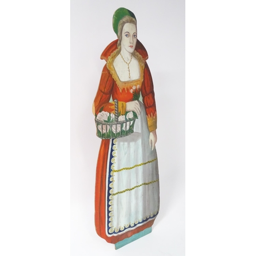 1267 - A large 20thC figural dummy board with hand painted decoration depicting a young lady holding a bask... 