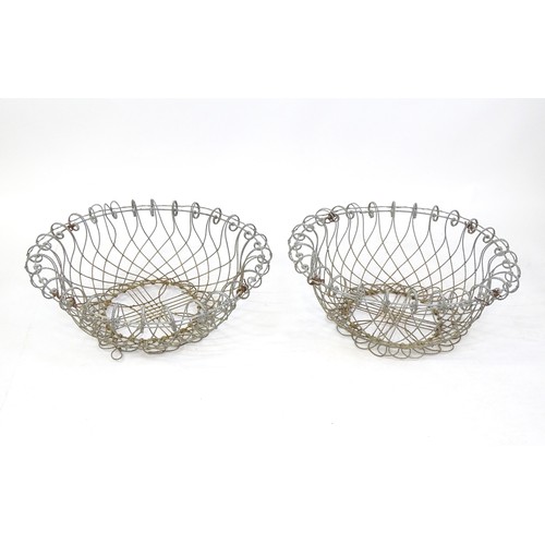 1330 - A pair of 19thC wirework planters / baskets with scrolling detail. Each approx. 24