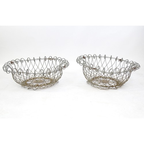 1330 - A pair of 19thC wirework planters / baskets with scrolling detail. Each approx. 24