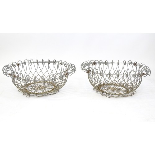 1330 - A pair of 19thC wirework planters / baskets with scrolling detail. Each approx. 24