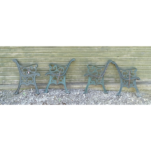 1345 - Garden / Architectural : Four cast iron bench frame ends, with scroll decoration and green painted f... 