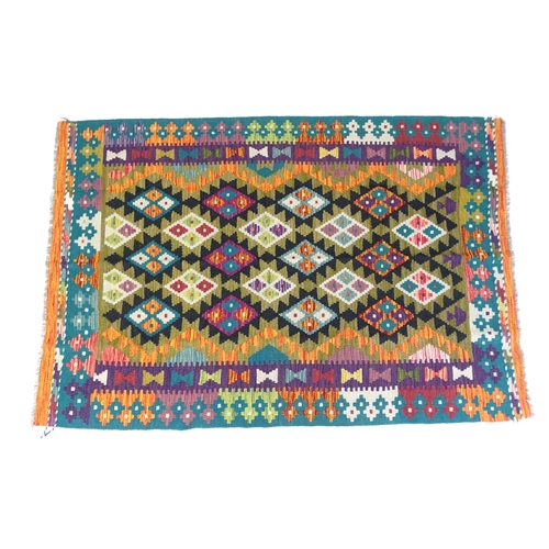 1351 - Carpet / Rug : A Maimana Kilim decorated with geometric motifs. Approx. 77 1/2