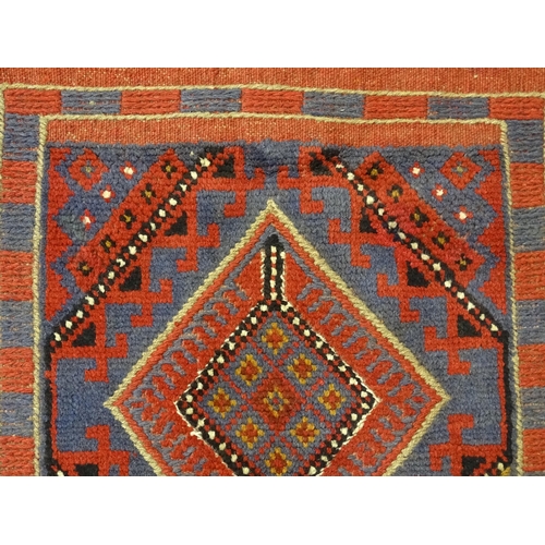 1352 - Carpet / Rug : A Meshwani runner  with red and blue ground having geometric detail. Approx.   105