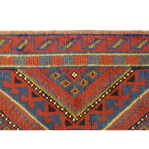 1352 - Carpet / Rug : A Meshwani runner  with red and blue ground having geometric detail. Approx.   105