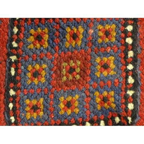 1352 - Carpet / Rug : A Meshwani runner  with red and blue ground having geometric detail. Approx.   105