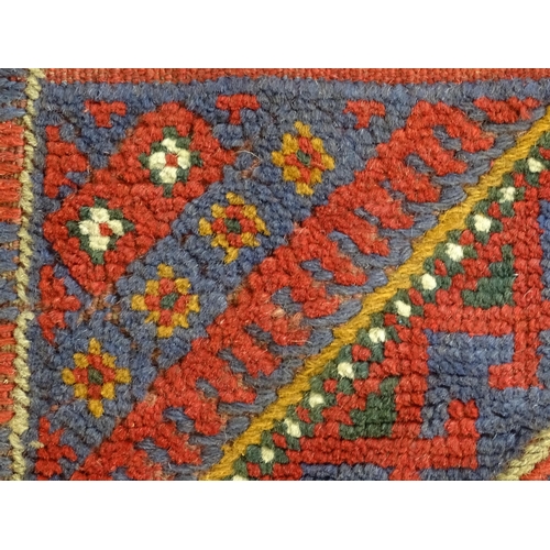 1352 - Carpet / Rug : A Meshwani runner  with red and blue ground having geometric detail. Approx.   105