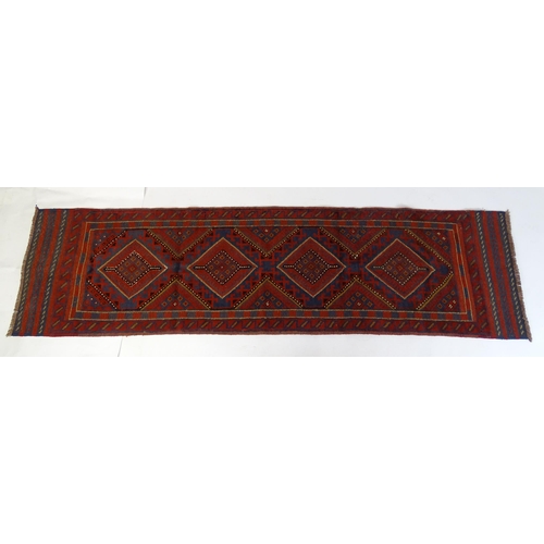 1352 - Carpet / Rug : A Meshwani runner  with red and blue ground having geometric detail. Approx.   105