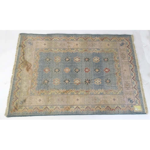 1353 - Carpet / Rug : A Gabbeh rug with blue and grey grounds decorated with geometric motifs. Approx.  93