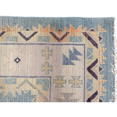 1353 - Carpet / Rug : A Gabbeh rug with blue and grey grounds decorated with geometric motifs. Approx.  93