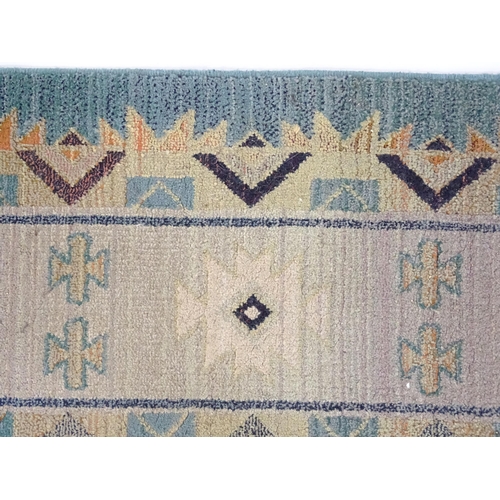 1353 - Carpet / Rug : A Gabbeh rug with blue and grey grounds decorated with geometric motifs. Approx.  93