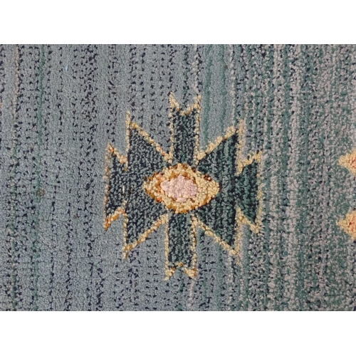 1353 - Carpet / Rug : A Gabbeh rug with blue and grey grounds decorated with geometric motifs. Approx.  93