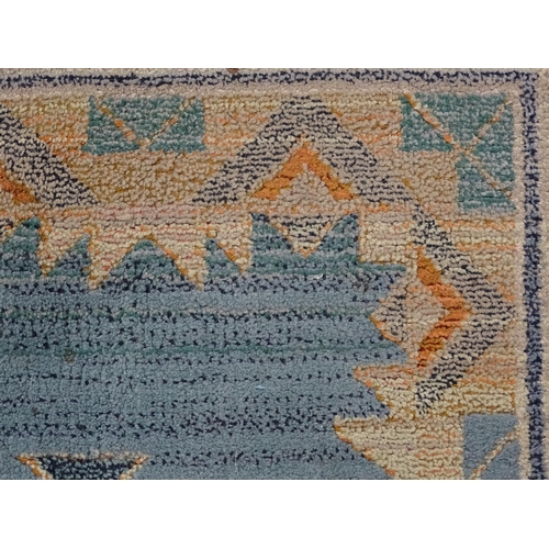 1353 - Carpet / Rug : A Gabbeh rug with blue and grey grounds decorated with geometric motifs. Approx.  93