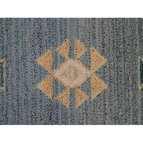 1353 - Carpet / Rug : A Gabbeh rug with blue and grey grounds decorated with geometric motifs. Approx.  93