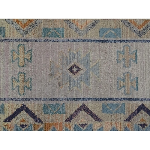 1353 - Carpet / Rug : A Gabbeh rug with blue and grey grounds decorated with geometric motifs. Approx.  93