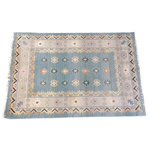 1353 - Carpet / Rug : A Gabbeh rug with blue and grey grounds decorated with geometric motifs. Approx.  93