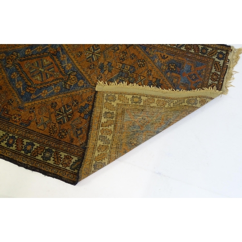 1359 - Carpet / Rug : A Belouch rug, the dark blue and red ground decorated with diamond and pole detail an... 