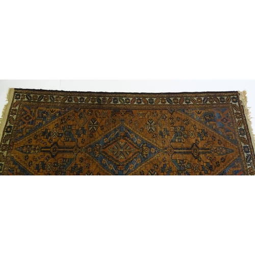 1359 - Carpet / Rug : A Belouch rug, the dark blue and red ground decorated with diamond and pole detail an... 