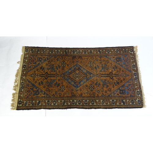 1359 - Carpet / Rug : A Belouch rug, the dark blue and red ground decorated with diamond and pole detail an... 