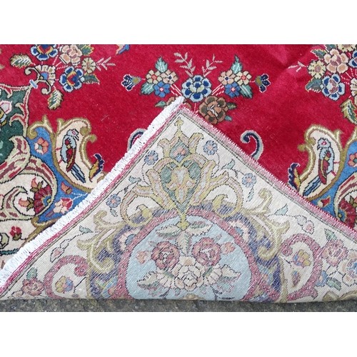 1386 - Carpet / Rug : A Persian Tabriz carpet, the red and cream grounds decorated with vignettes depicting... 