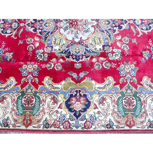 1386 - Carpet / Rug : A Persian Tabriz carpet, the red and cream grounds decorated with vignettes depicting... 