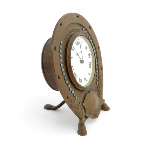 1399 - A presentation mantle clock the surround of horseshoe form with turquoise coloured cabochon detail t... 