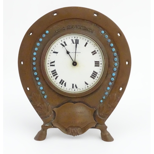 1399 - A presentation mantle clock the surround of horseshoe form with turquoise coloured cabochon detail t... 